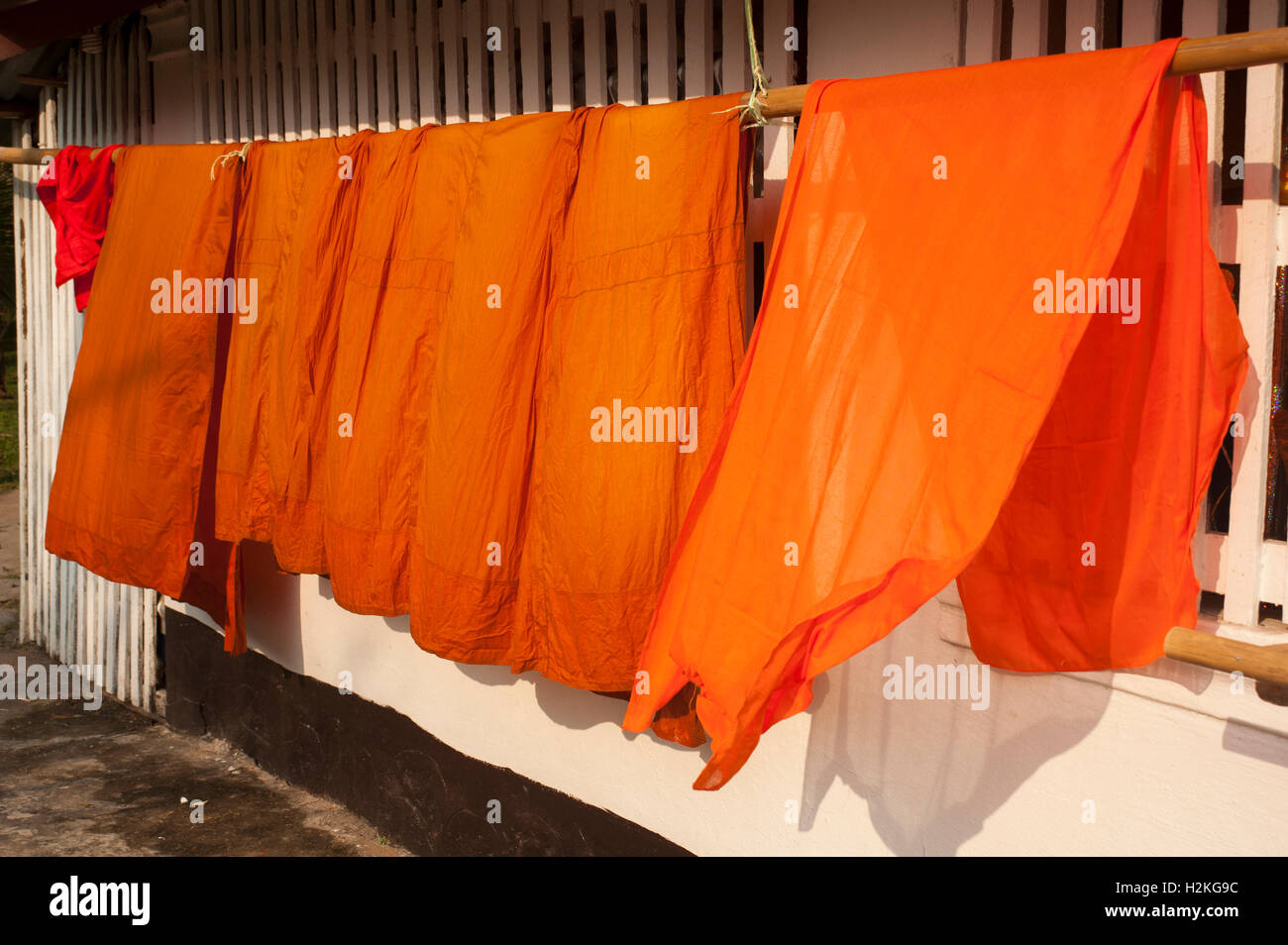 Buddhist Monks robes drying on a rail Stock Photo