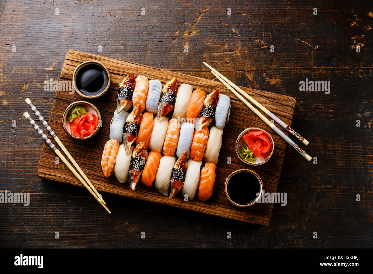 Nigiri sushi set for two on wooden serving board block copy space Stock Photo