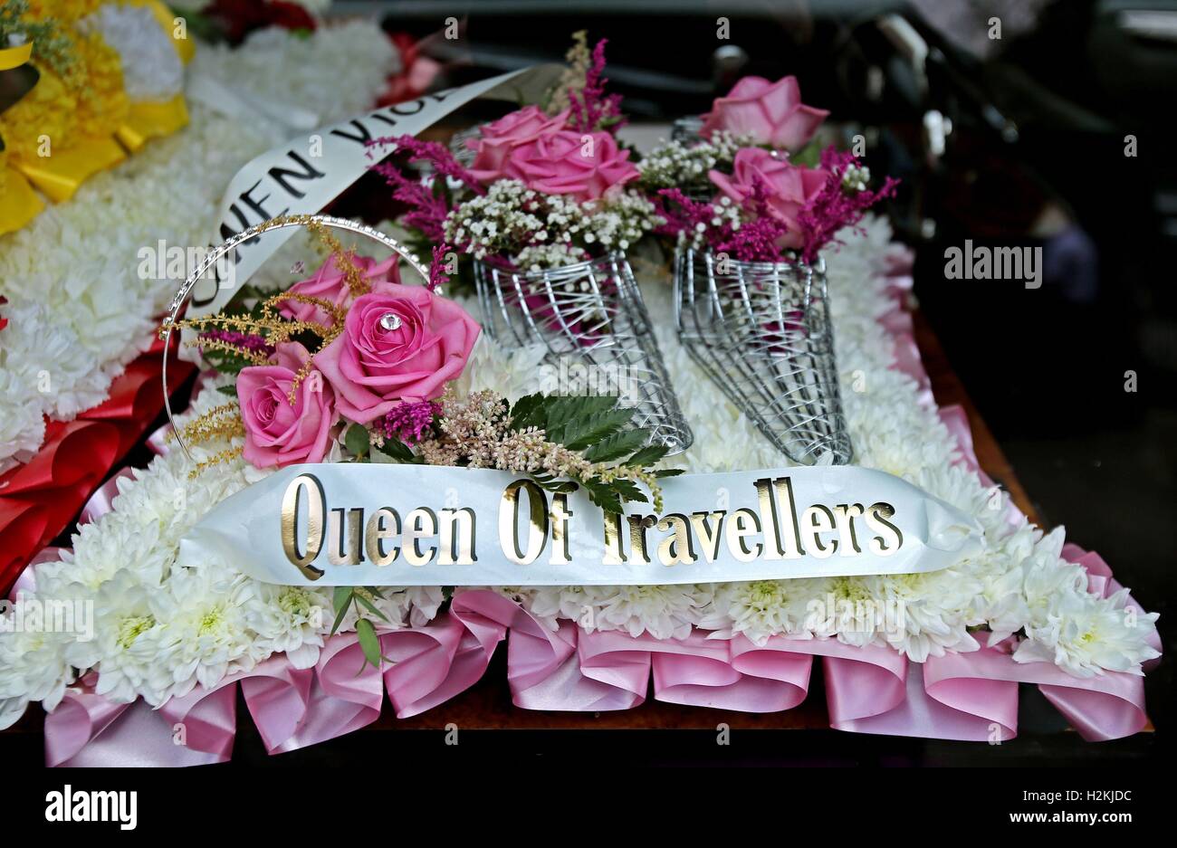 Wreaths are laid during the funeral of mother-of-11 Violet Crumlish, dubbed the Queen of the Travellers, takes place at St Peter's Church in Lurgan, County Armagh. Stock Photo