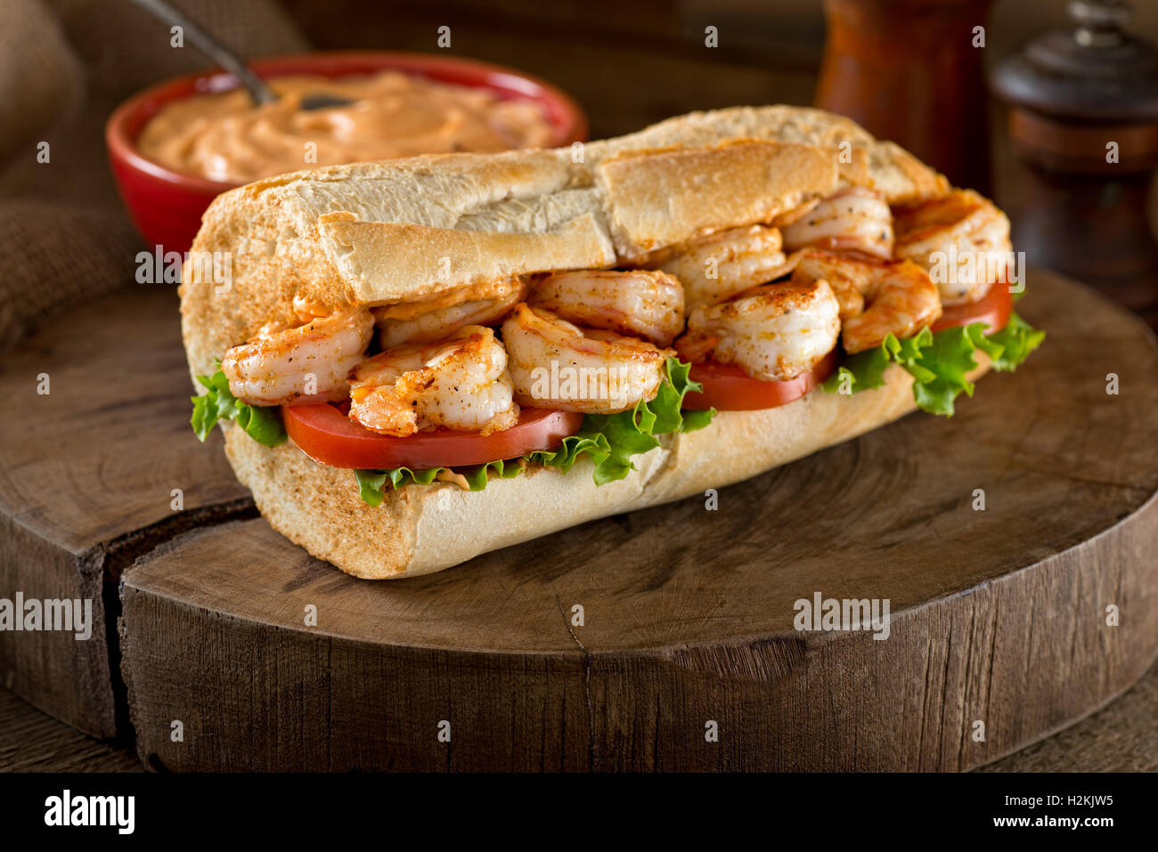 A delicious home made grilled shrimp Po Boy sandwich on baguette