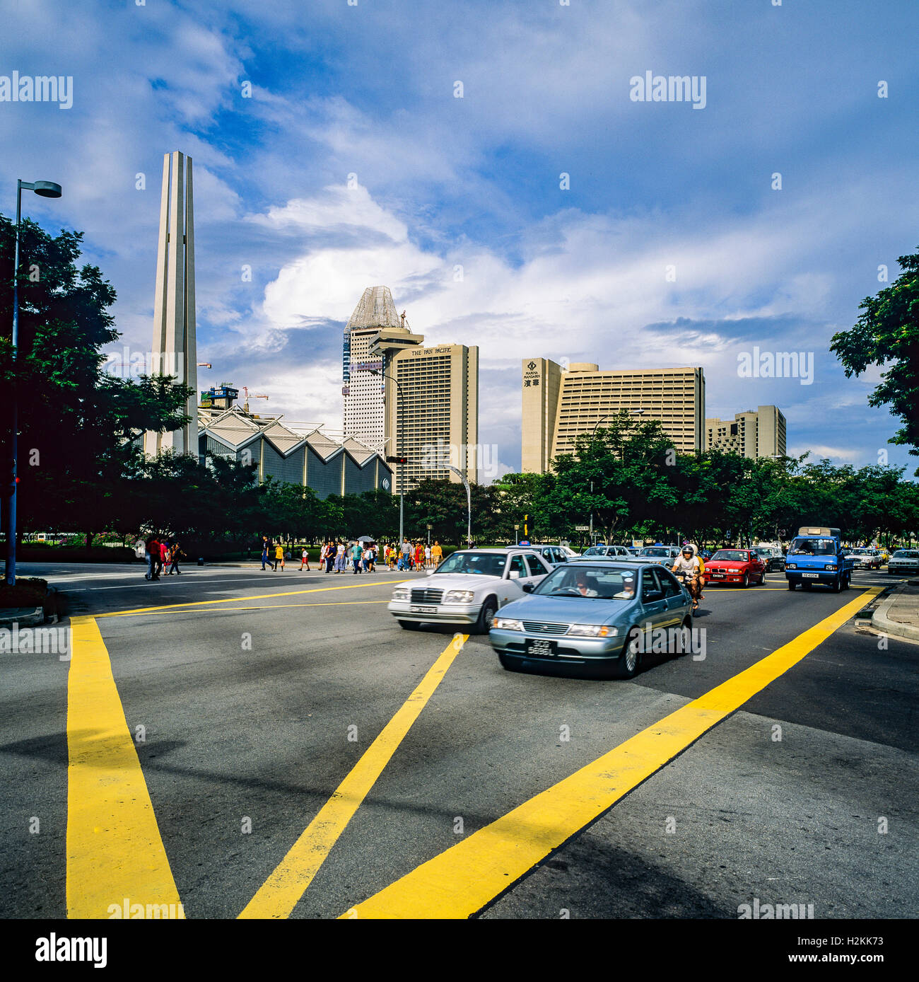 Car traffic, yellow junction box, arrow, Singapore Stock Photo Alamy
