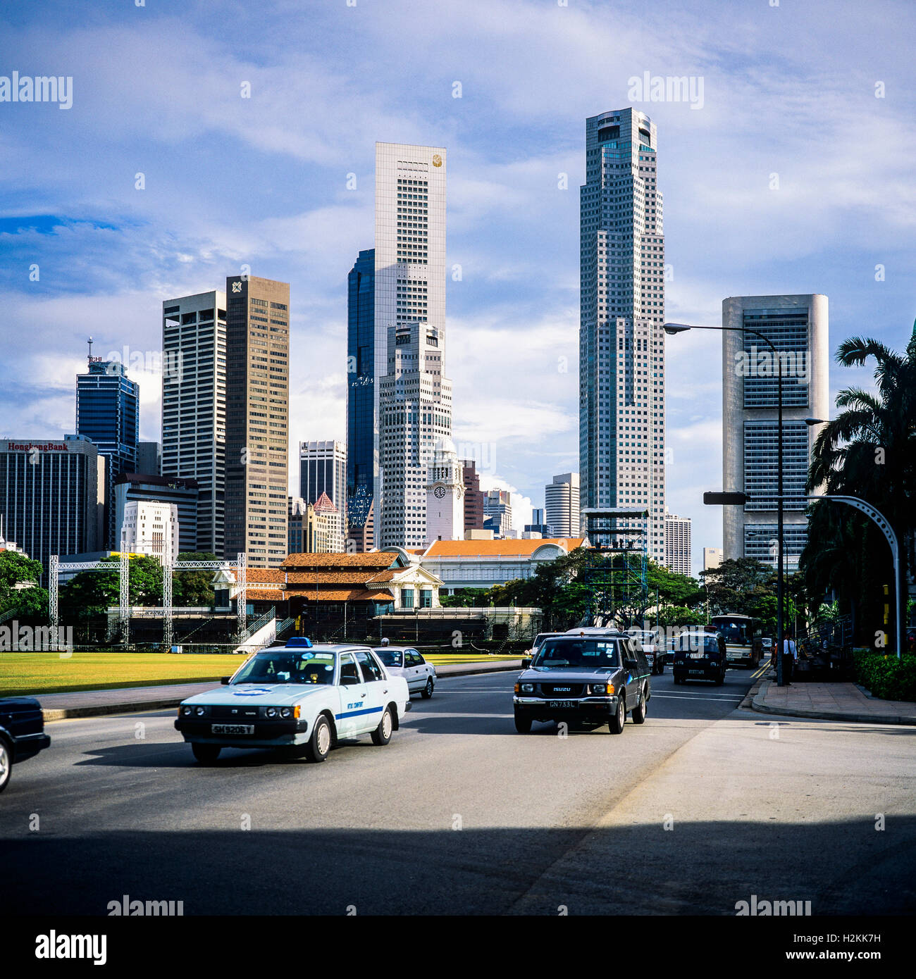Cars traffic at Padang and Central business district skyscrapers, Singapore Stock Photo