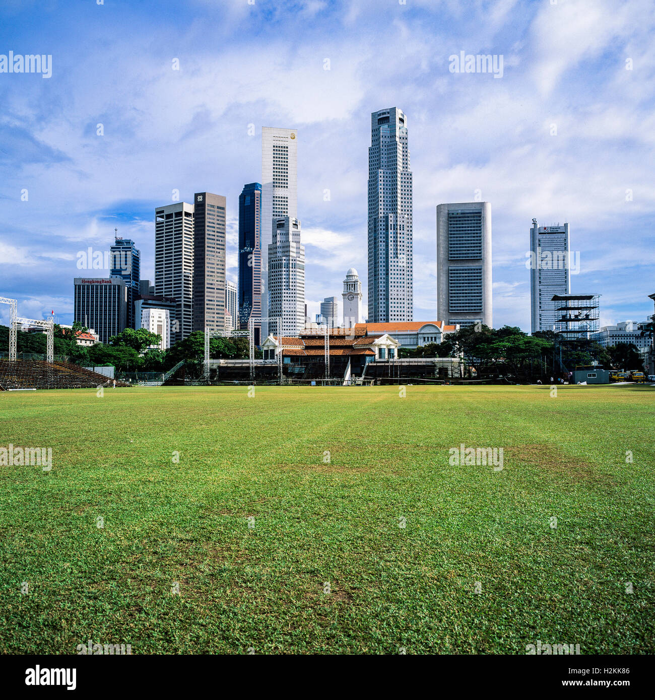Padang cricket ground and Central business district skyline with skyscrapers, Singapore Stock Photo