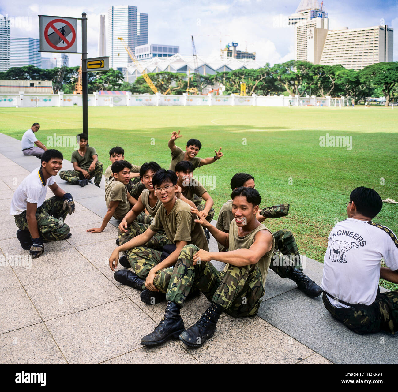 Army servicemen having a break, Padang ground, Singapore Stock Photo