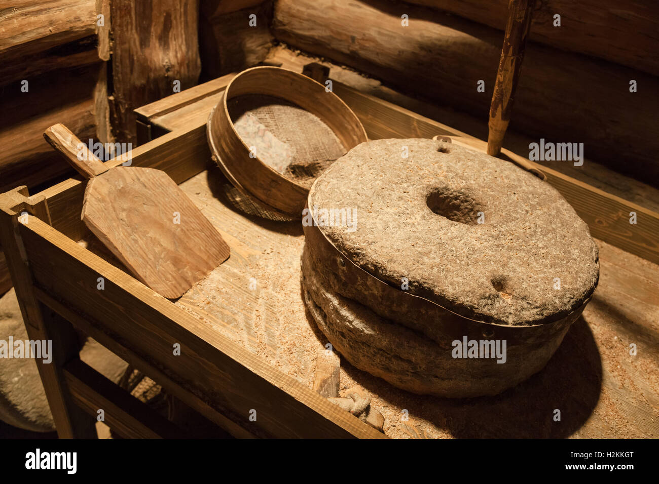 Old millstones for grinding grain, vintage farming tools Stock Photo