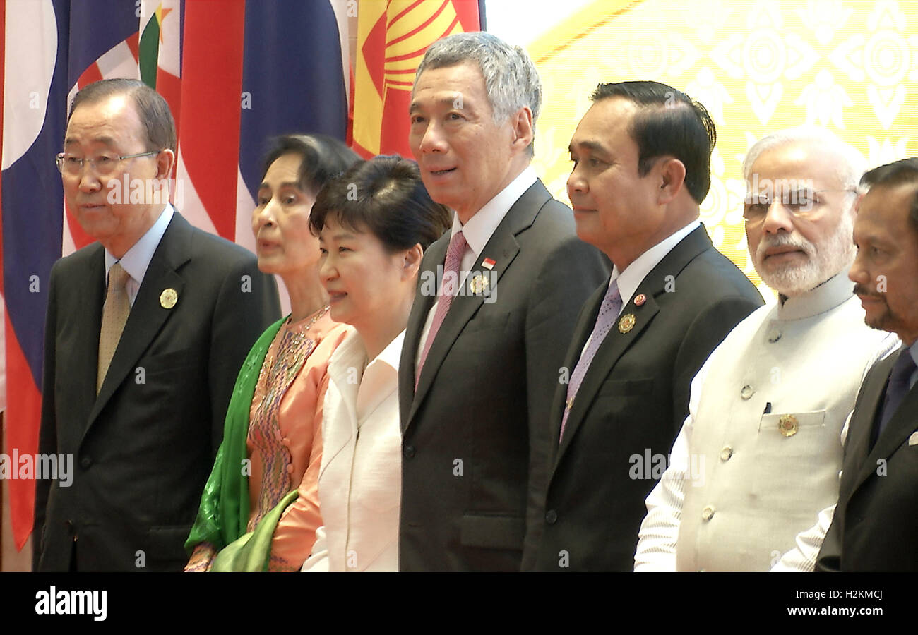 Leaders stand for a group photo during the Association of Southeast Asian Nations (ASEAN) summit the Laotian capital Vientiane. Stock Photo