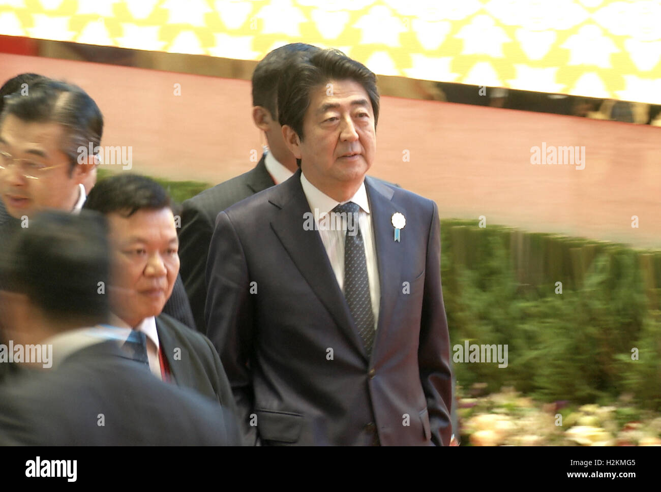 Shinzō Abe, Prime Minister of Japan walks to a meeting during the Association of Southeast Asian Nations (ASEAN) summit the Laotian capital Vientiane. Stock Photo