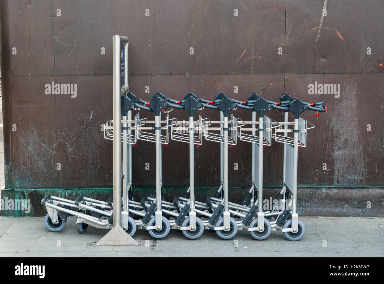 Luggage trolleys outside Oslo central station Norway Stock Photo Alamy
