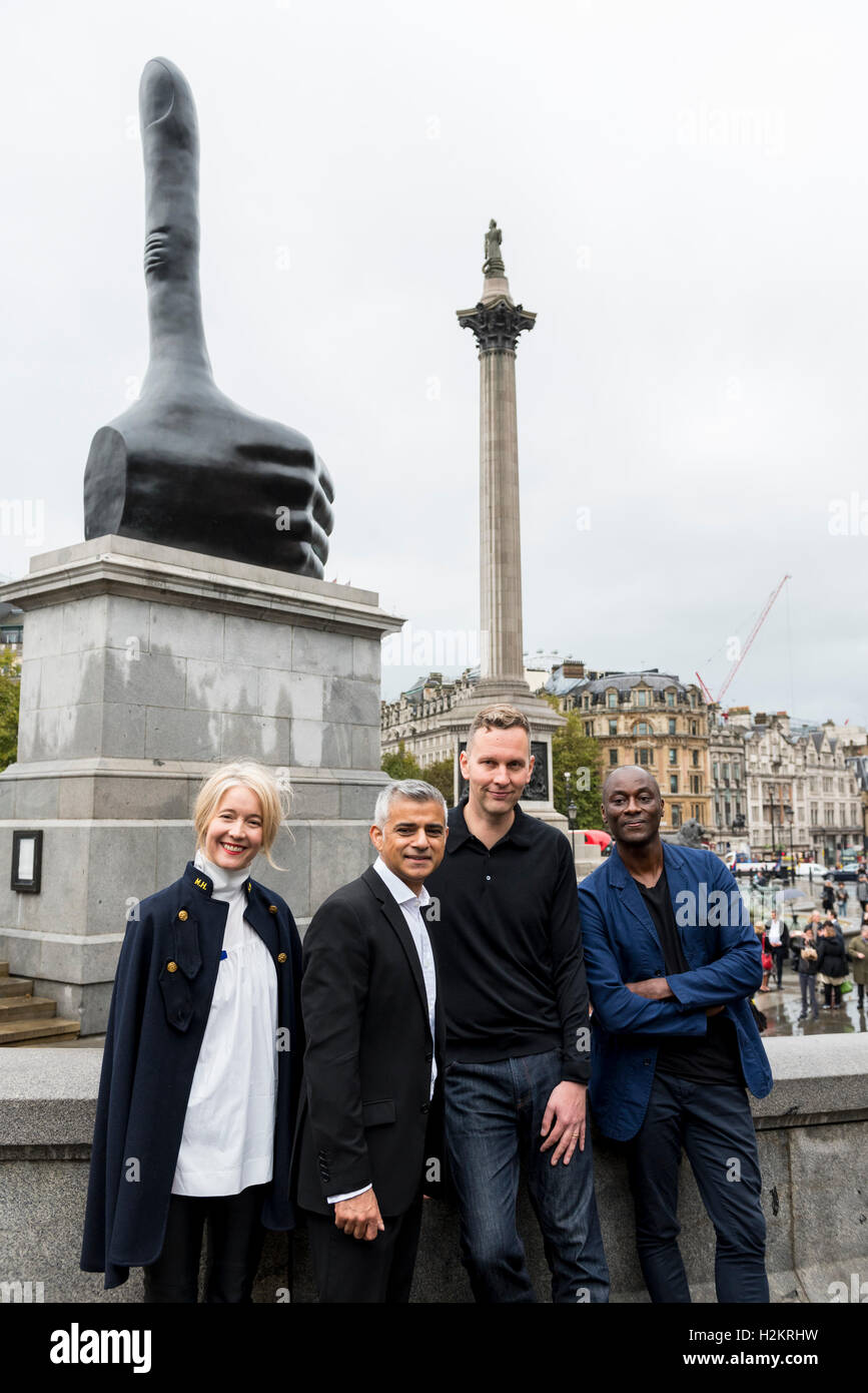 London, UK  29 September 2016. Justine Simons, Deputy Mayor for Culture, Sadiq Khan, Mayor of London, David Shrigley and Ekow Eshun, Chair of the Fourth Plinth commissioning group stand together as the latest artwork to sit on The Fourth Plinth in Trafalgar Square is unveiled.  'Really Good' by David Shrigley is a seven metre tall bronze hand with an elongated thumb, which the artist hopes to become a self fulfilling prophecy.  The Fourth Plinth is a programme inviting world-class artists to bring new artwork to the capital. Credit:  Stephen Chung / Alamy Live News Stock Photo