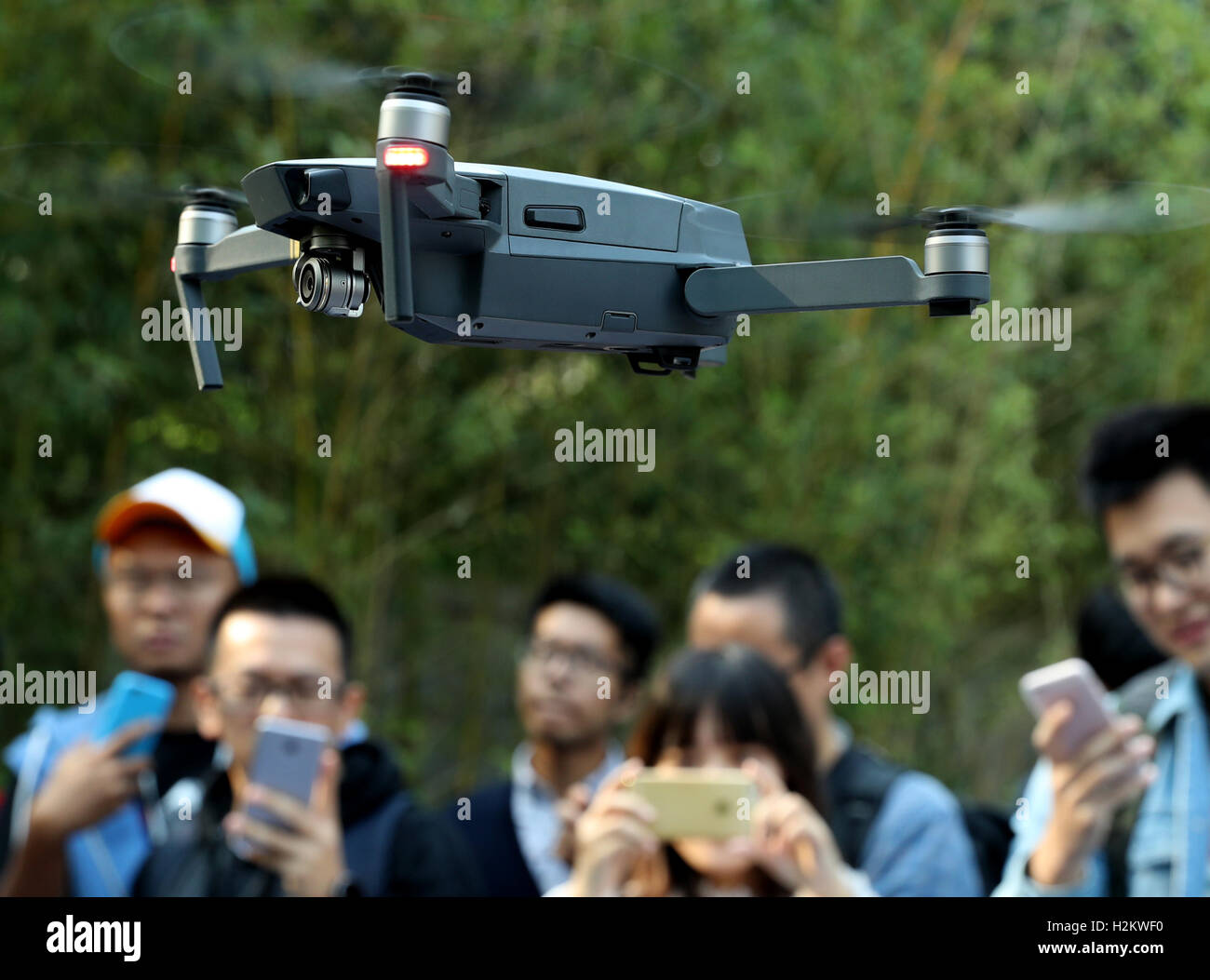 Beijing China. 29th Sep 2016. Journalists watch the performance of the DJI Mavic Pro during a press conference in Beijing capital of China Sept. 29 2016. The Mavic Pro is a small