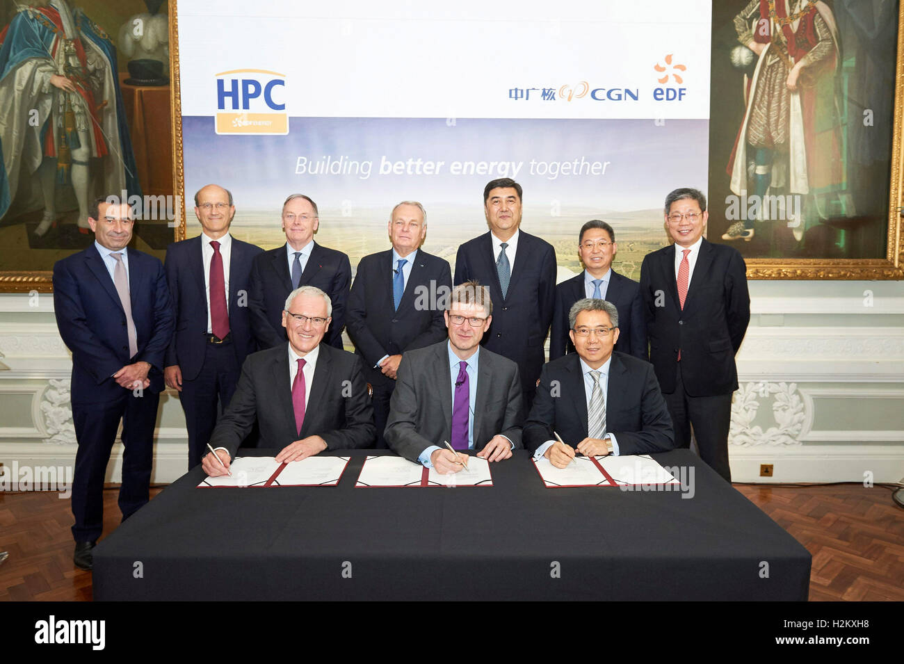 London, Britain. 29th Sep, 2016. (Front, L-R) chairman and CEO of French energy company EDF Jean-Bernard Levy, British Secretary of State for Business, Energy and Industrial Strategy Greg Clark, chairman of China General Nuclear Power Corporation (CGN) He Yu attend a signing ceremony in London, Britain, Sept. 29, 2016. CGN announced Thursday that it has signed all final agreements for the Hinkley Point C (HPC) project, and a suite of agreements relating to the projects of Sizewell C and Bradwell B, with French energy company EDF and the British government. Credit:  Roy Baron/Xinhua/Alamy Live  Stock Photo