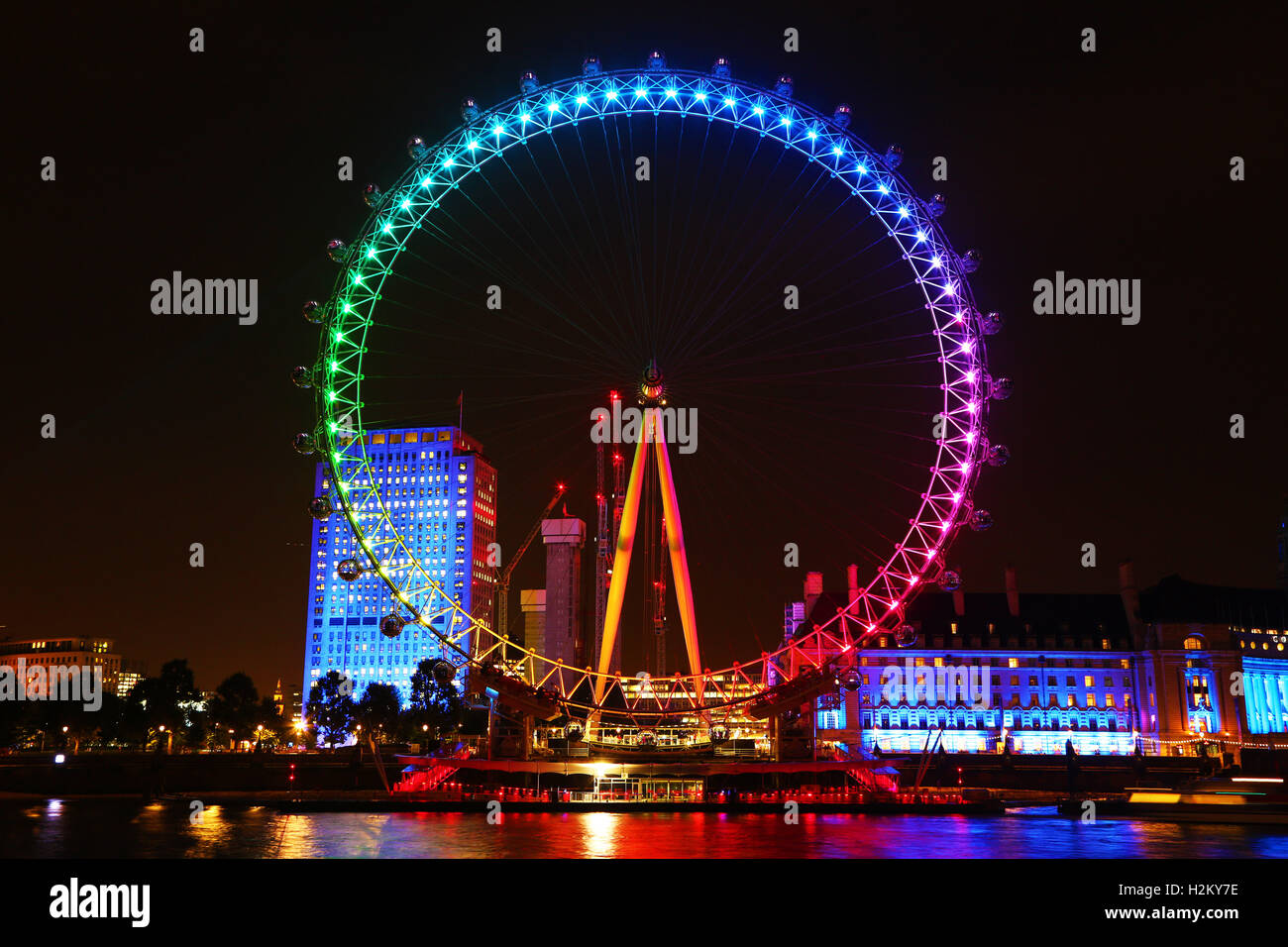 London, UK. 29th September 2016. The London Eye was illuminated in colourful Rainbow colours for to promote the movie Trolls in London Credit:  Paul Brown/Alamy Live News Stock Photo
