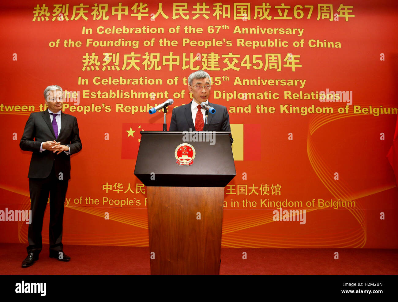 Brussels, Brussels. 28th Sep, 2016. Qu Xing (R), Chinese ambassador to Belgium, addresses a reception held to celebrate the 67th anniversary of the founding of the People's Republic of China and the 45th anniversary of the establishment of the diplomatic relations between the People's Republic of China and the Kingdom of Belgium, in Brussels, Belgium Sept. 28, 2016. © Ye Pingfan/Xinhua/Alamy Live News Stock Photo