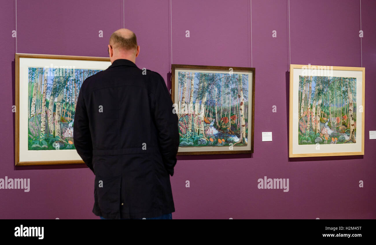A visitor looks around the exhibition 'Nikolai Astrup: Norway,' lies in the Kunsthalle in Emden, Germany, 30 September 2016. The painter Nikolai Astrup (1880-1928) achieved fame and recognition in Norway with large oil paintings and technically elaborate wood cuts. However, his pieces were barely seen internationally. The Emden Kunsthalle is now showing a comprehensive exhibition with 150 pictures for the first time. Photo: THORSTEN HELMERICHS/dpa Stock Photo