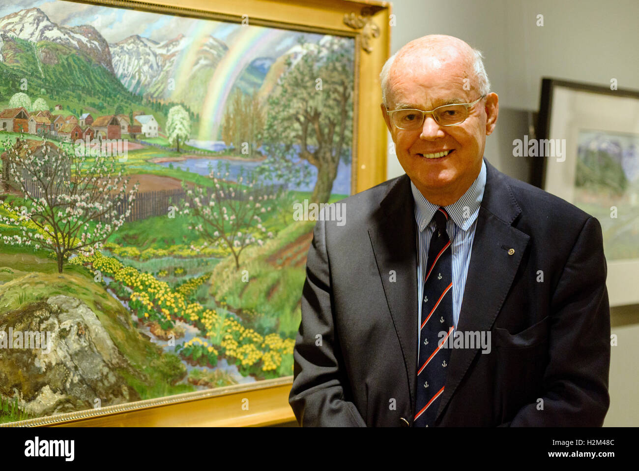 Emden, Germany. 30th Sep, 2016. Folkert Hinrichs, chairman of the board of the Kunsthalle Emden, Eske Nannen, stands in the exhibition 'Nikolai Astrup: Norway, ' lies in the Kunsthalle in Emden, Germany, 30 September 2016. The painter Nikolai Astrup (1880-1928) achieved fame and recognition in Norway with large oil paintings and technically elaborate wood cuts. However, his pieces were barely seen internationally. The Emden Kunsthalle is now showing a comprehensive exhibition with 150 pictures for the first time. Photo: THORSTEN HELMERICHS/dpa/Alamy Live News Stock Photo