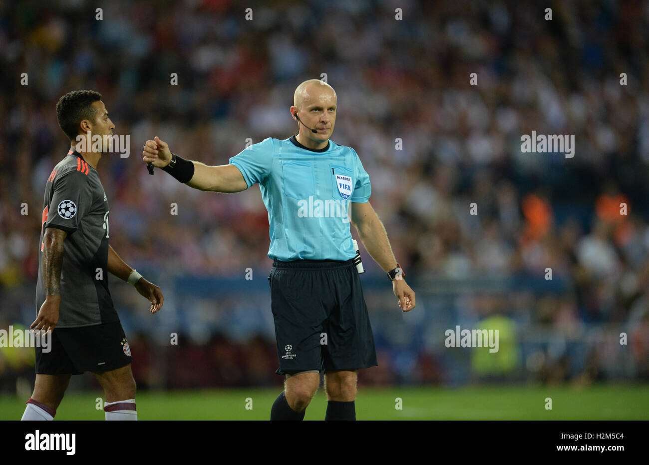 Madrid, Spain. 28th Sep, 2016. Referee Szymon Marciniak gesticulates during the match of Atlético Madrid against Bavaria Munich on the second match day of the Champions League, group phase, group D, at the Vincente Calderón Stadium in Madrid, Spain, 28 September 2016. PHOTO: ANDREAS GEBERT EPA/dpa/Alamy Live News Stock Photo