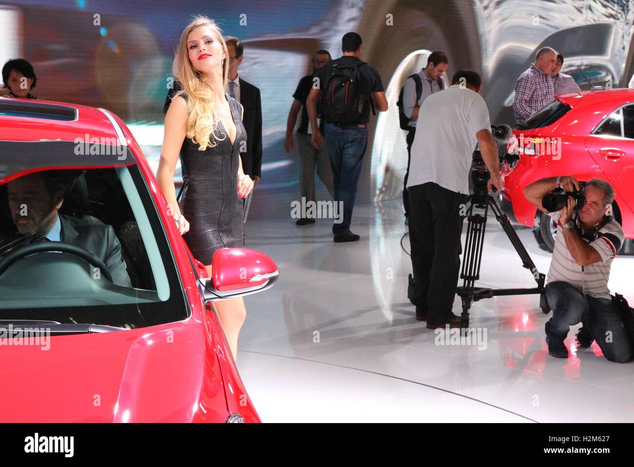 Paris, France. 30th September, 2016. A stewardess poses for a photo at 2016 Paris Motor Show. Credit:  Paul-Marie Guyon/Alamy Live News Stock Photo