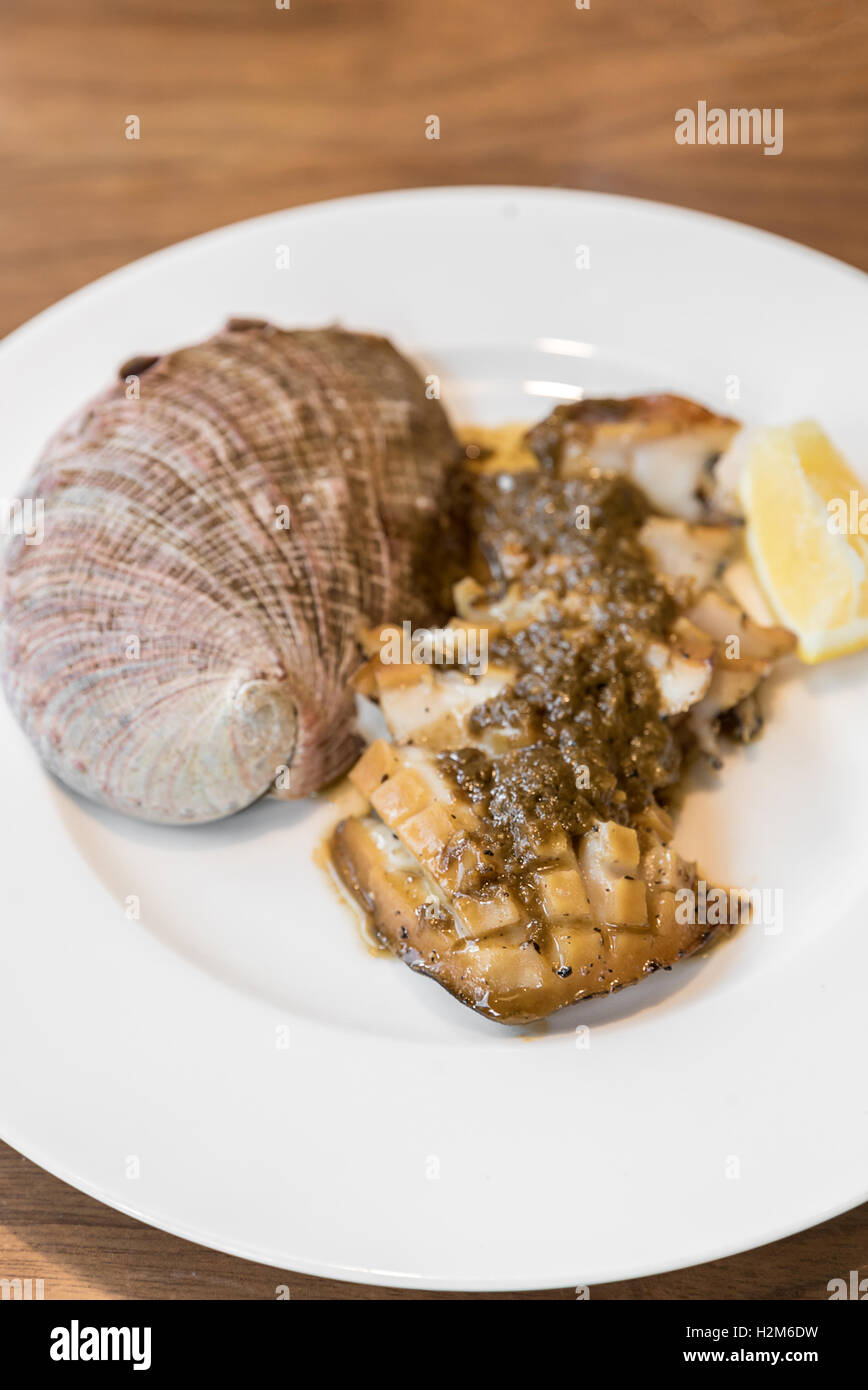 grilled Japanese Abalone steak with lemon Stock Photo Alamy