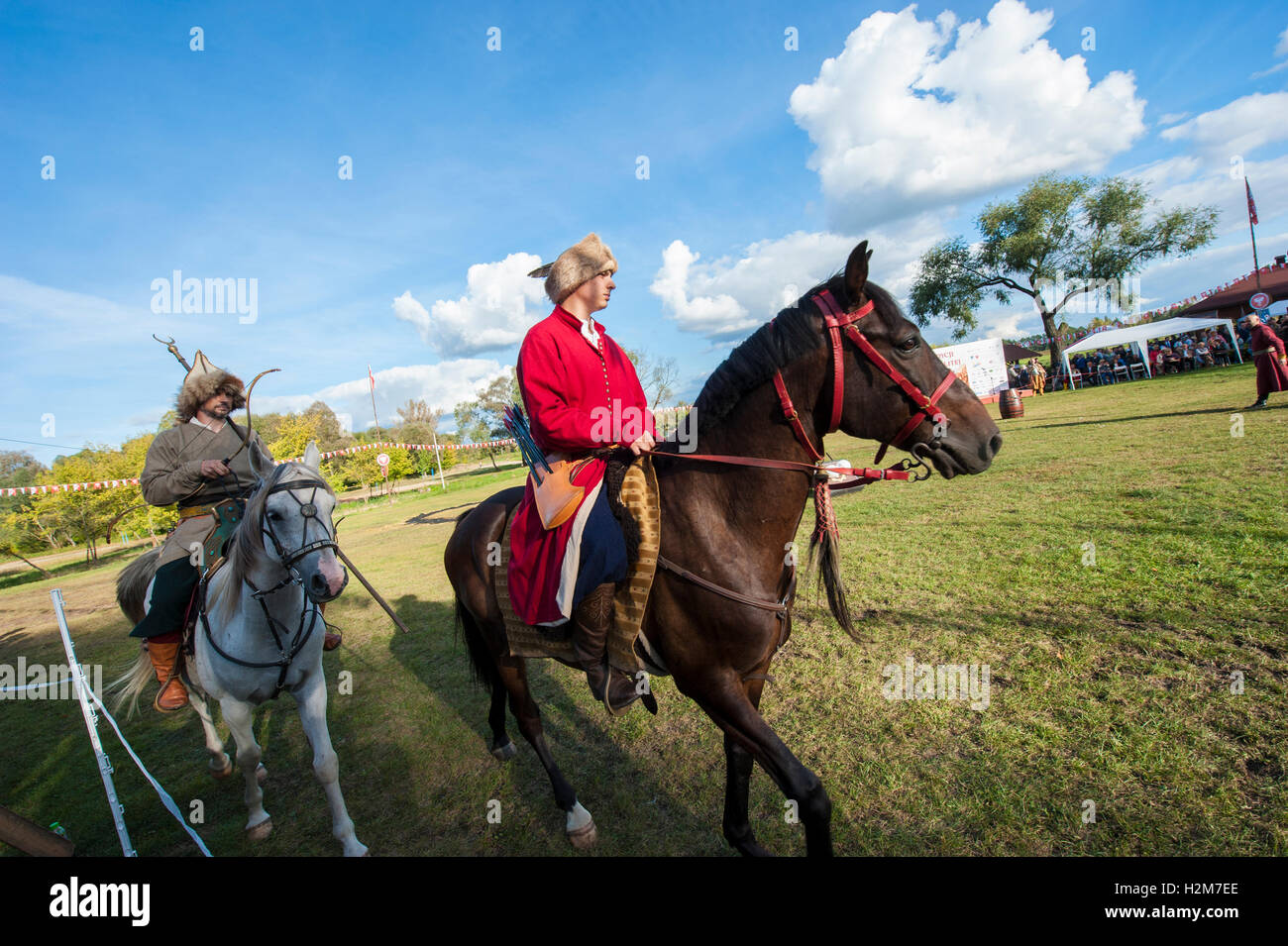 Horse riders in historical costumes during an open-air event in Pultusk ...