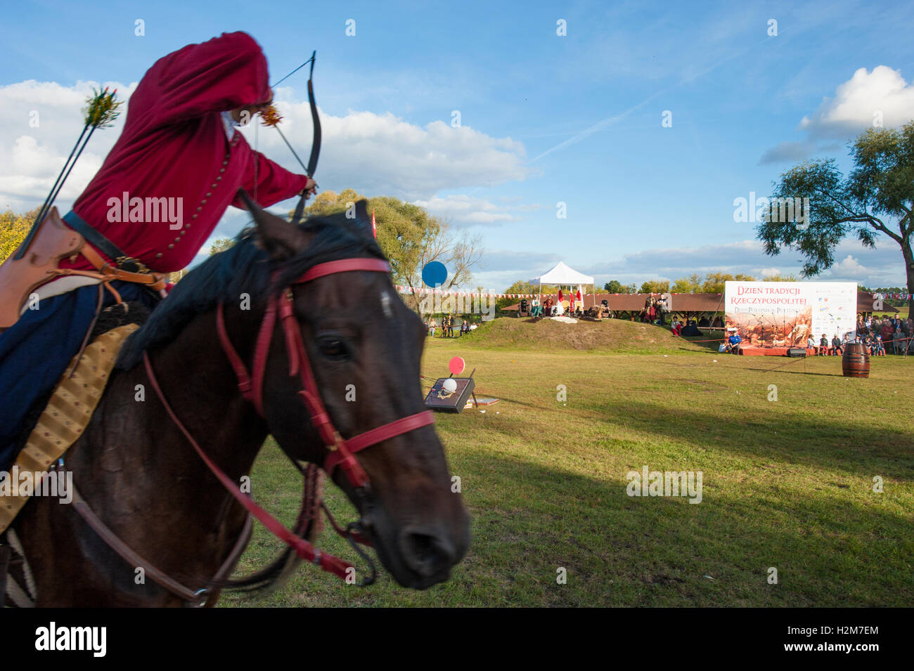 Horse riders in historical costumes during an open-air event in Pultusk ...