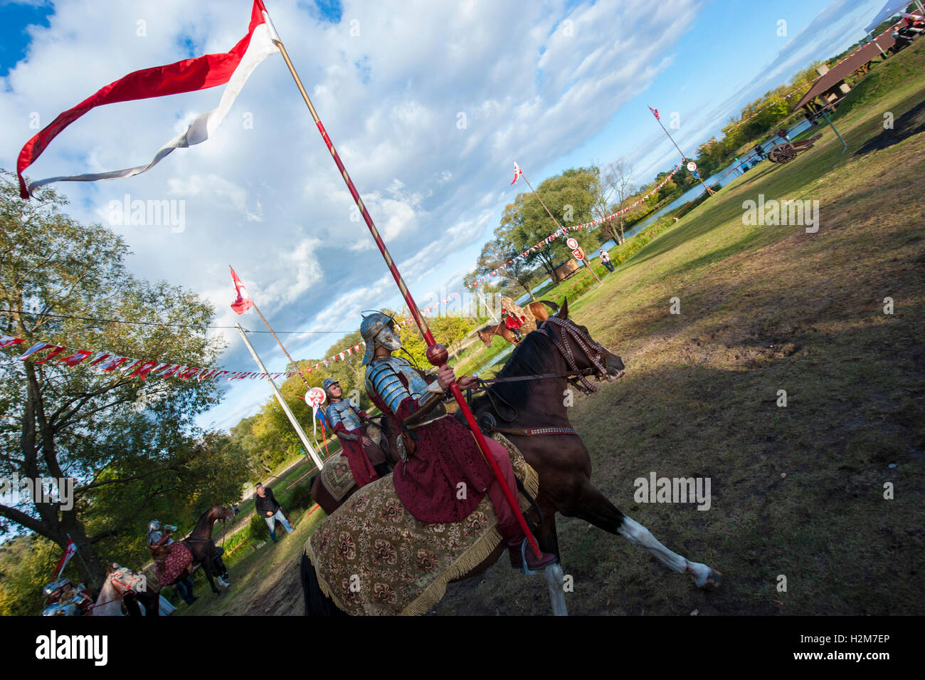 Horse riders in historical costumes during an open-air event in Pultusk ...