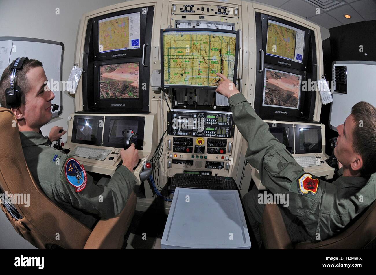 U.S. Air Force soldiers use simulators to learn how to fly and target drone aircraft during a training mission at Creech Air Force Base April 13, 2009 in Indian Springs, Nevada. Stock Photo
