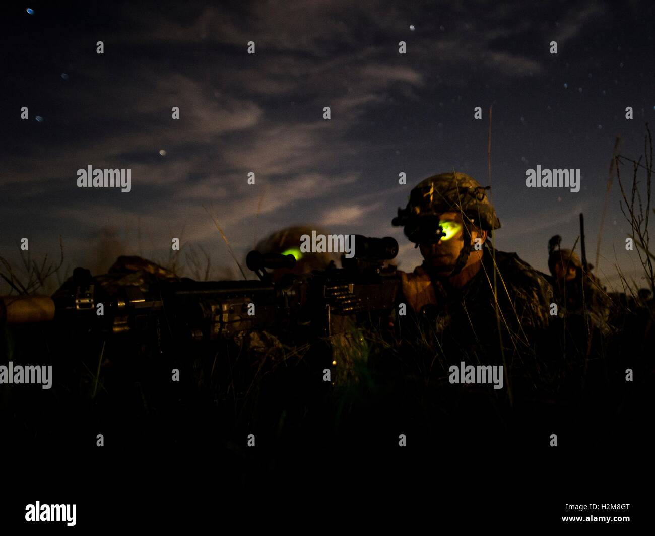 U.S. special operation soldiers use night vision goggles during a nighttime combat training exercise at the Eglin Air Force Base Camp Rudder July 16, 2014 in Okaloosa County, Florida. Stock Photo