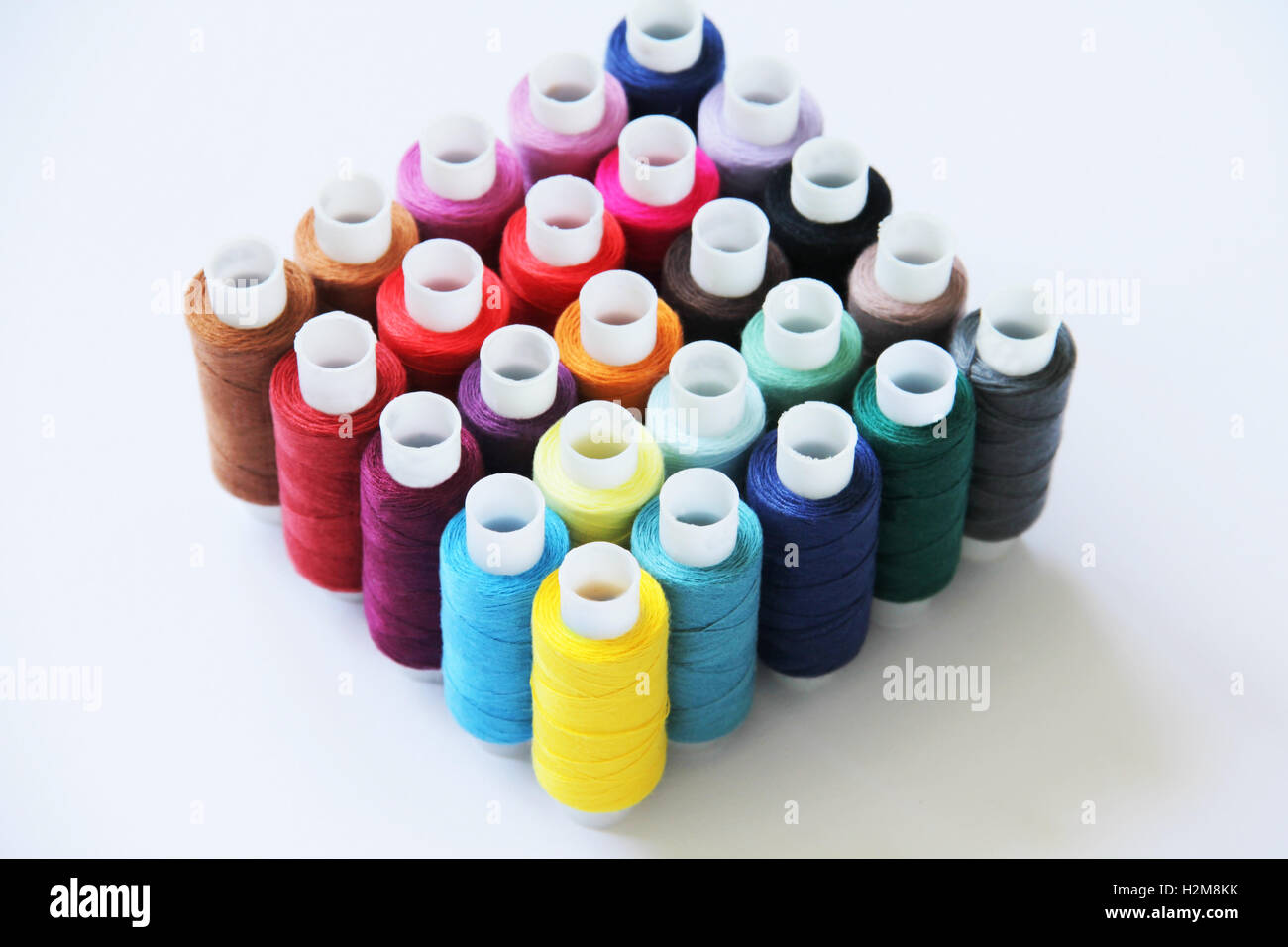 9 Pattern Threads Sewing threads of different colors in beautiful pattern Stock Photo - Alamy