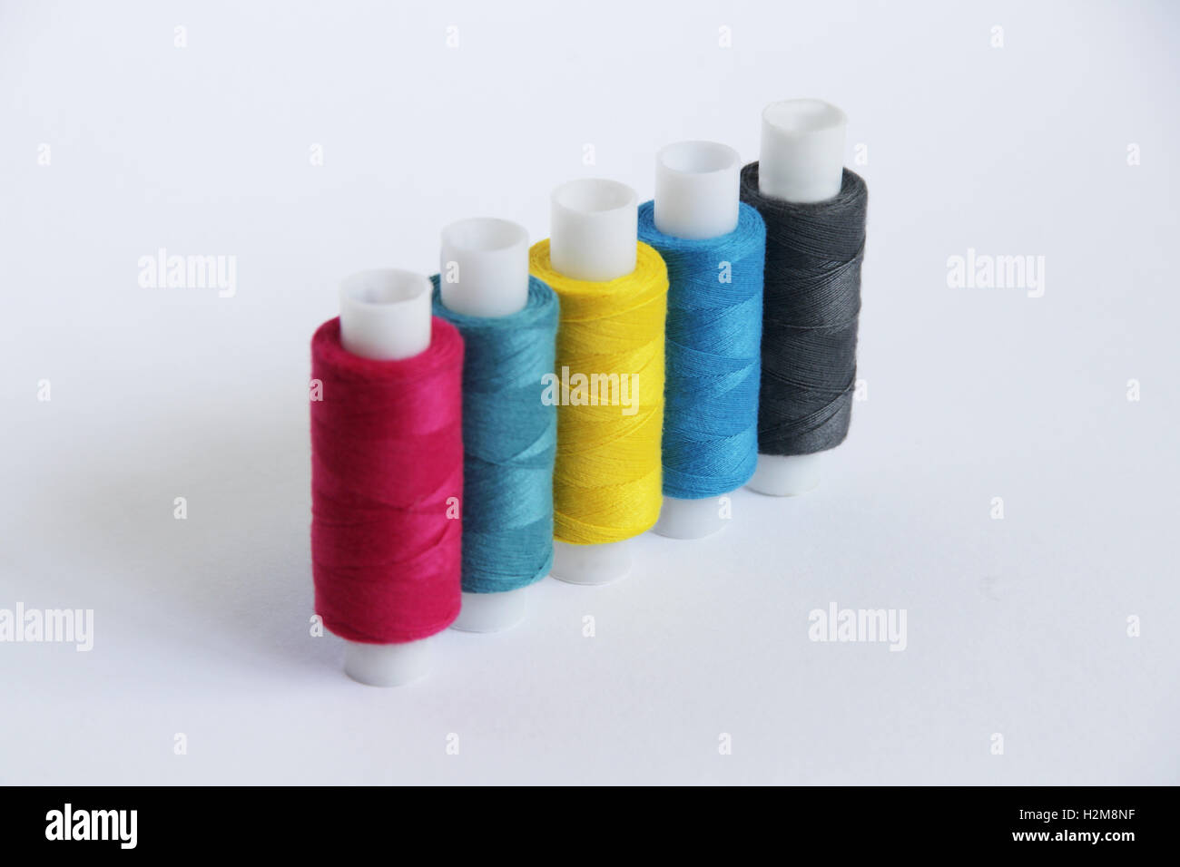 9 Pattern Threads Sewing threads of different colors in beautiful pattern Stock Photo - Alamy