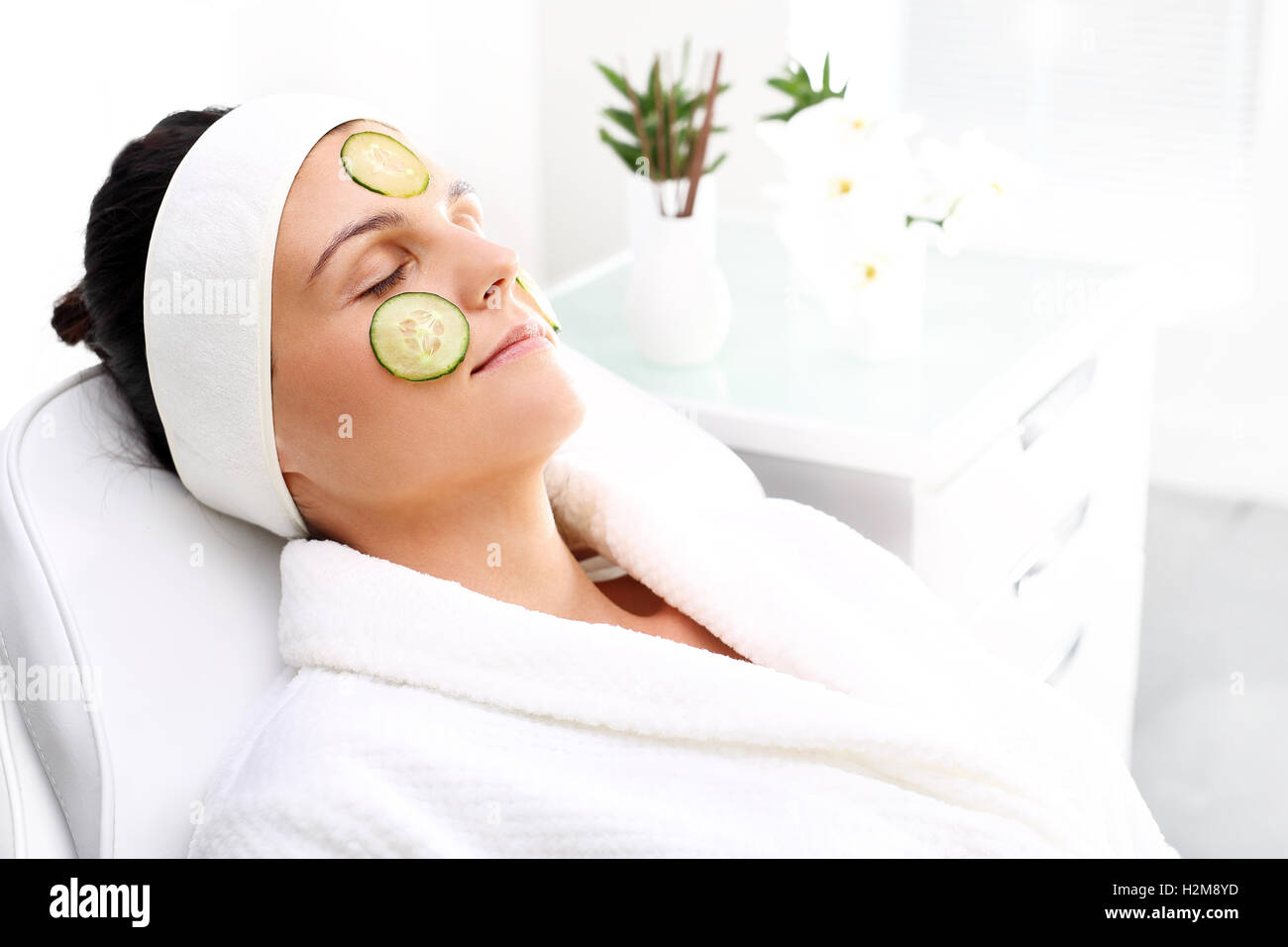 Cucumber mask. Care treatment in the beauty salon Stock Photo