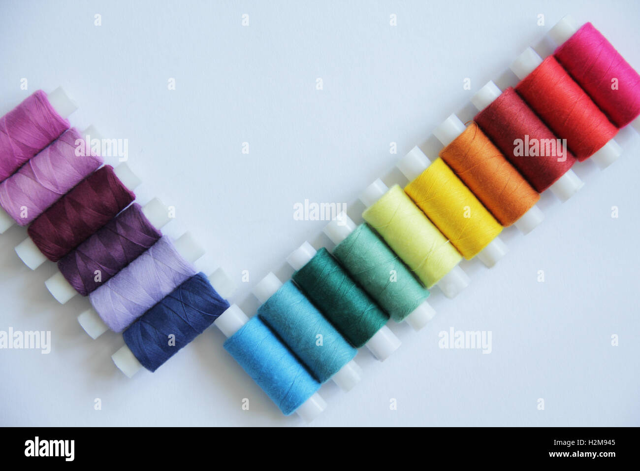 Sewing threads of different colors in beautiful pattern Stock Photo - Alamy