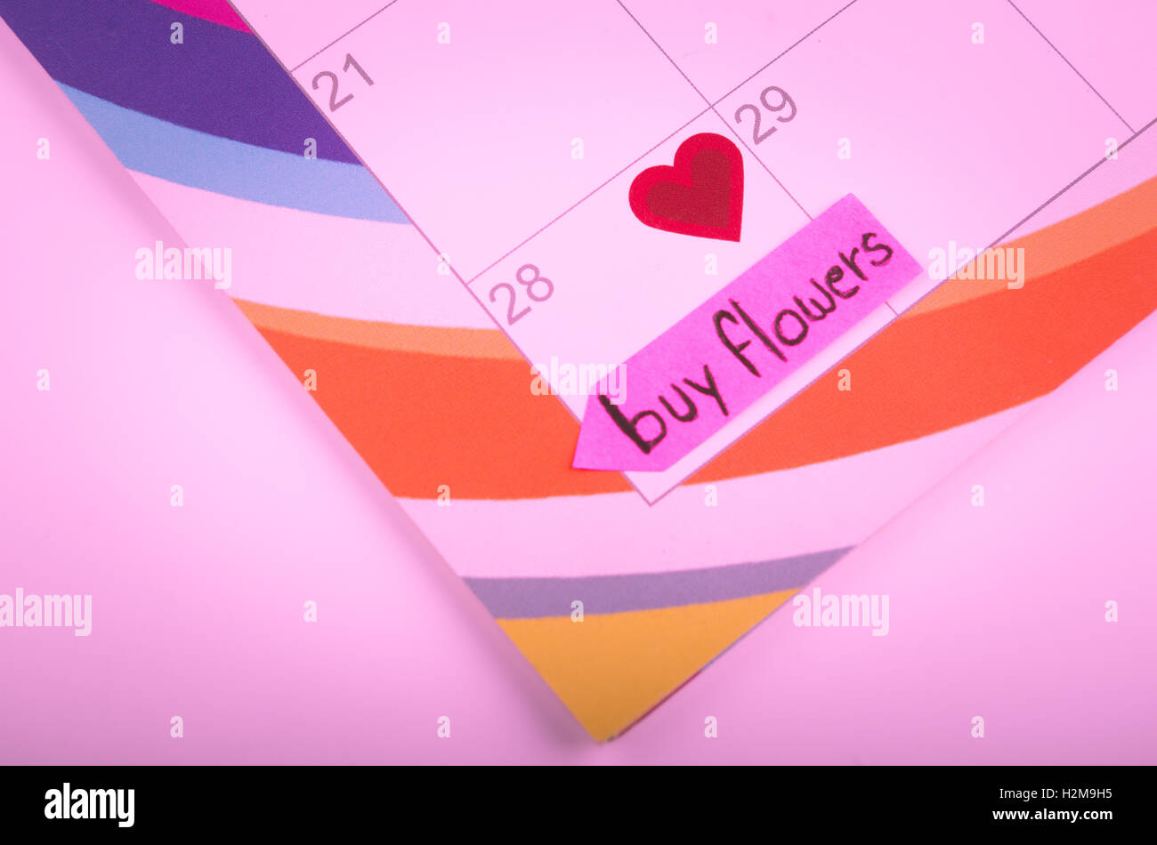 Calendar with a note to buy flowers Stock Photo Alamy