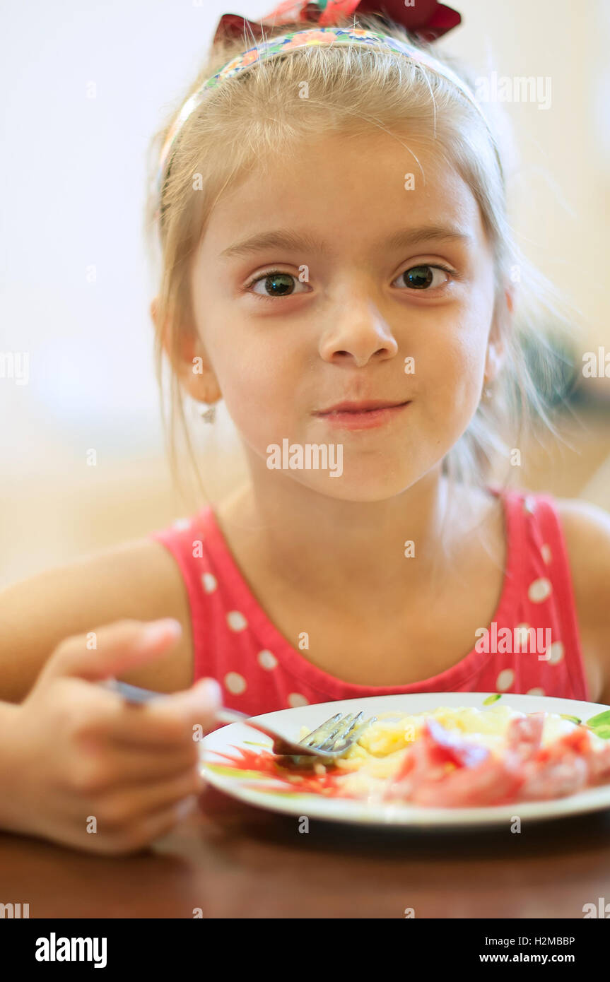 young girl eating pasta. A close up Stock Photo