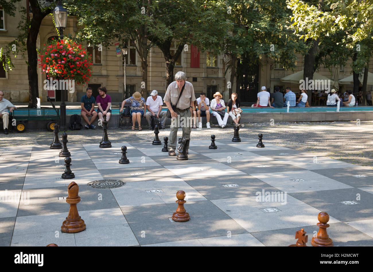 A man plays chess with large pieces in a street in Bratislava Slovakia  Stock Photo - Alamy