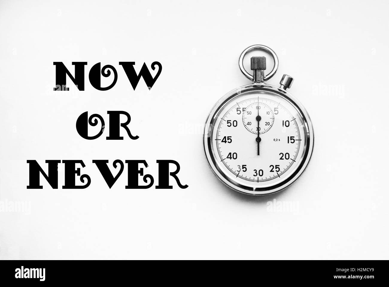 Stopwatches with text: Now or never Stock Photo