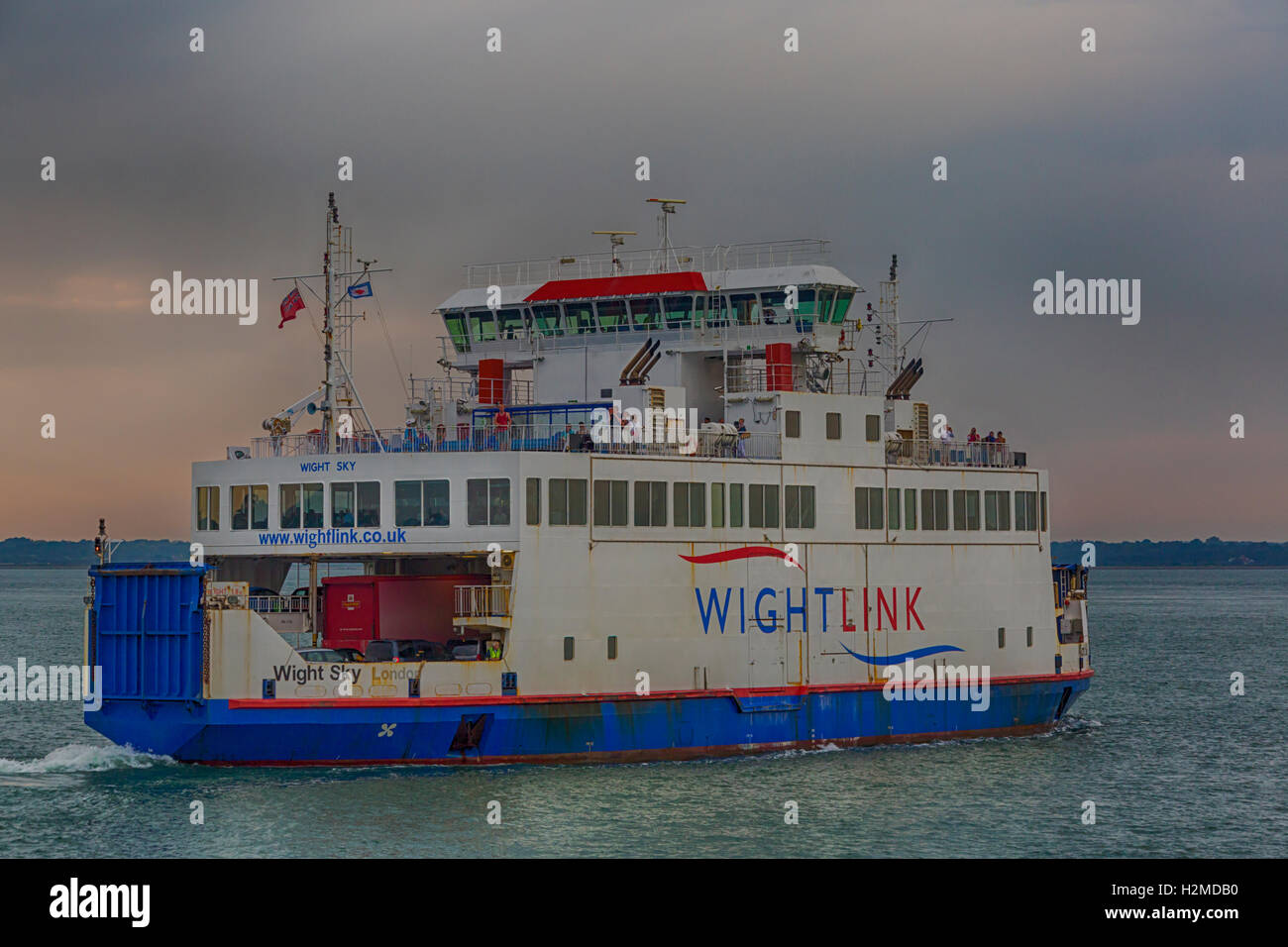 Wightlink ferry car ferry leaving Yarmouth on the Isle of Wight across the Solent to the mainland Lymington, Hampshire UK in September - HDR effect Stock Photo