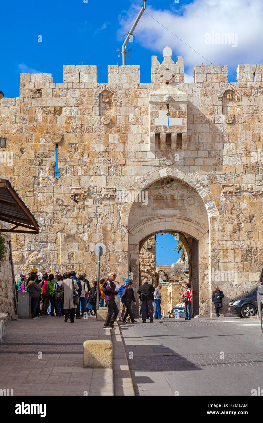 JERUSALEM, ISRAEL - FEBRUARY 20, 2013: Tourists walking near Lions gate of old city Stock Photo