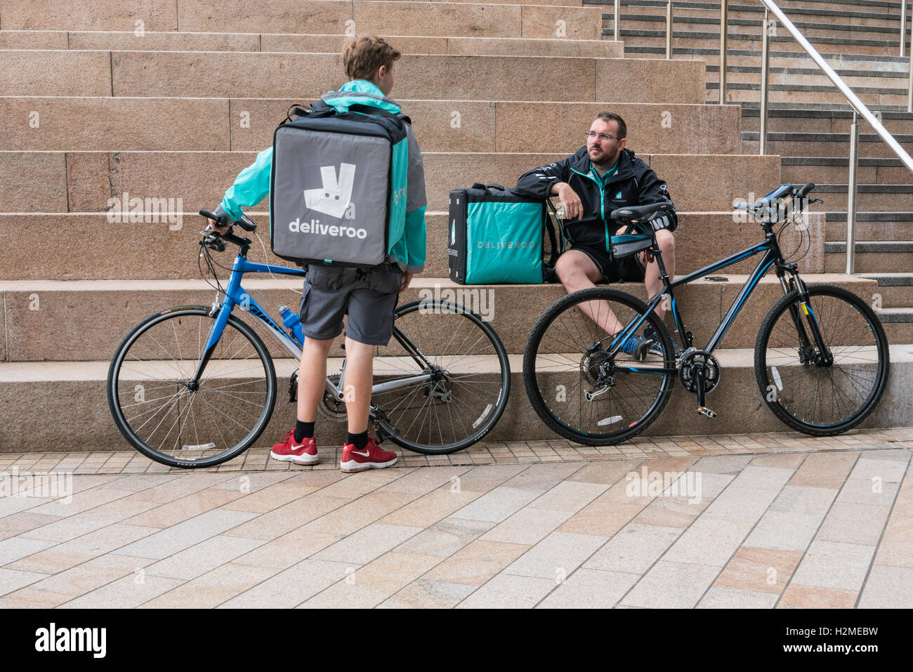 Deliveroo Riders chat on break at Liverpool One Stock Photo