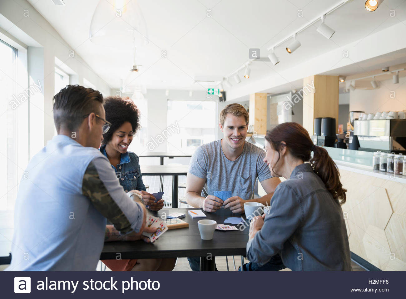 Friends playing cribbage game at cafe Stock Photo Alamy
