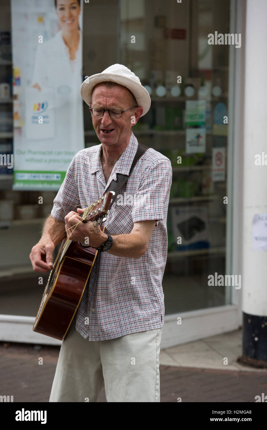 Street Busker playing guitar Cowes Isle of Wight Stock Photo
