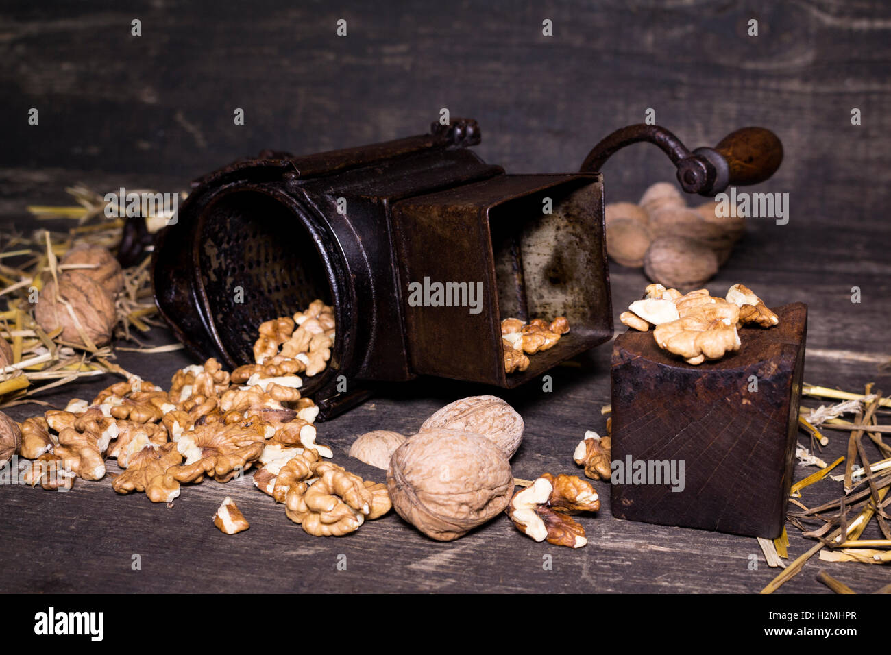 https://c8.alamy.com/comp/H2MHPR/wallnuts-and-hand-walnuts-grinder-on-a-wooden-surface-H2MHPR.jpg