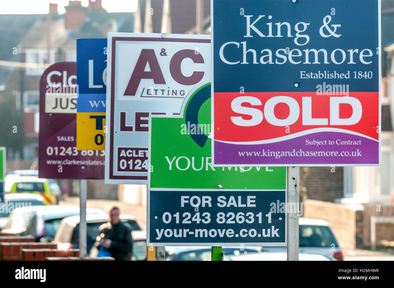 Estate agent boards decorating a street in Littlehampton Stock Photo Alamy