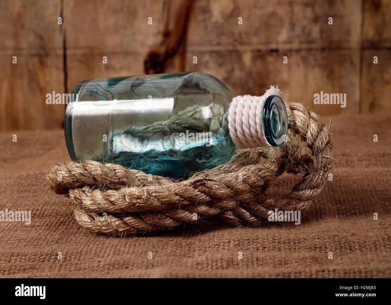 vintage objects,bottle and rope Stock Photo - Alamy