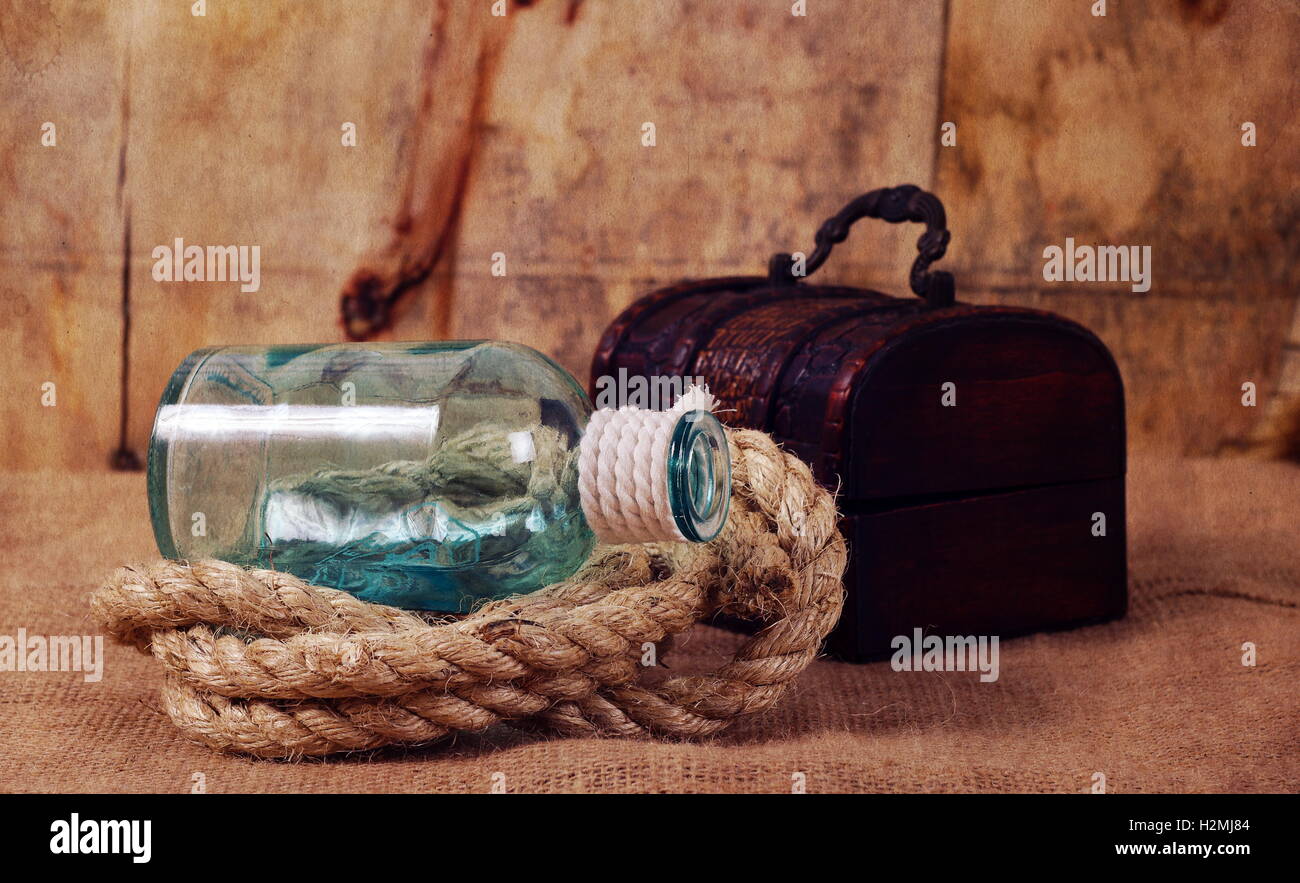 vintage objects,bottle,rope and chest Stock Photo - Alamy