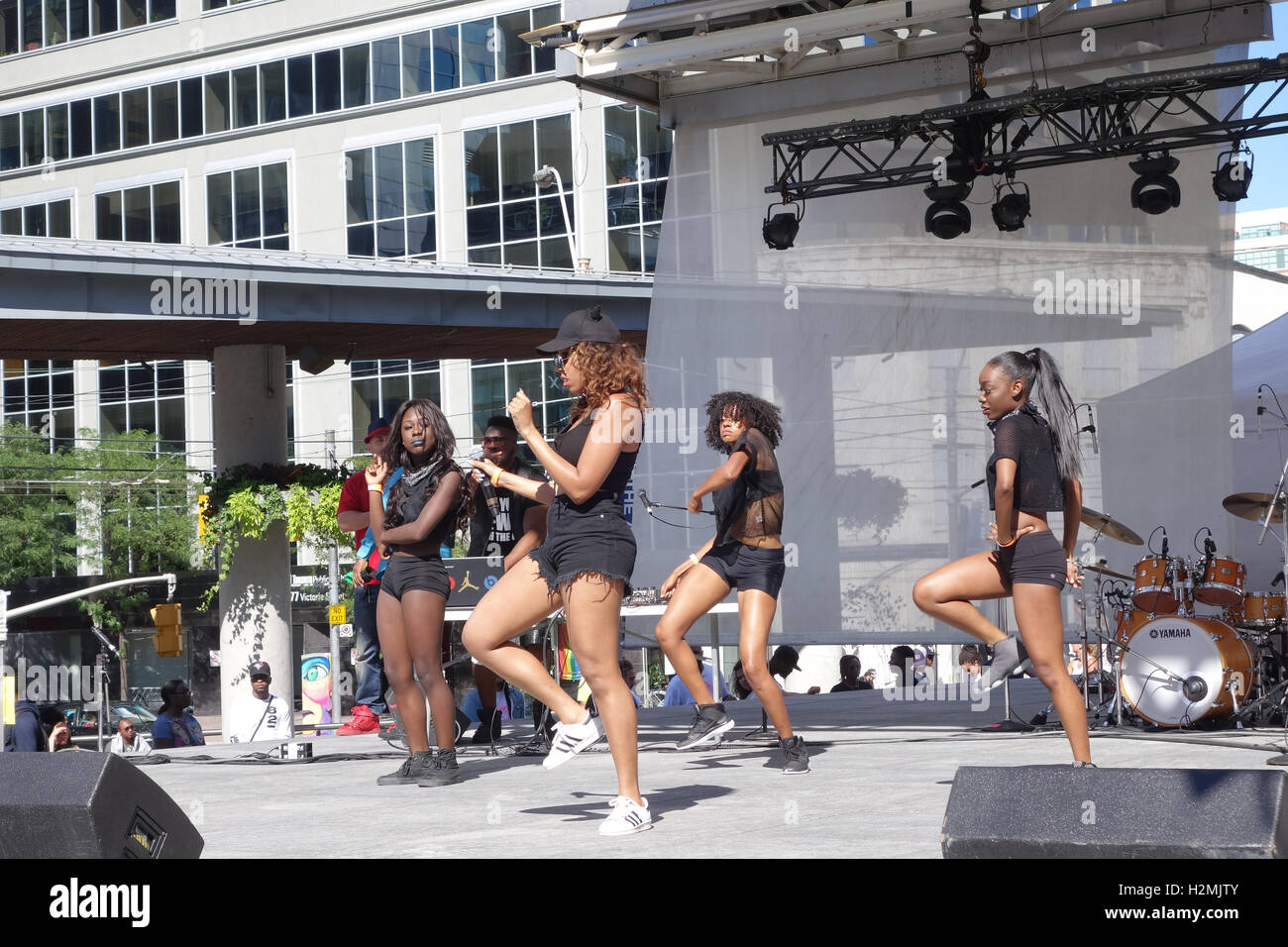 black women dancing stage outdoor Stock Photo