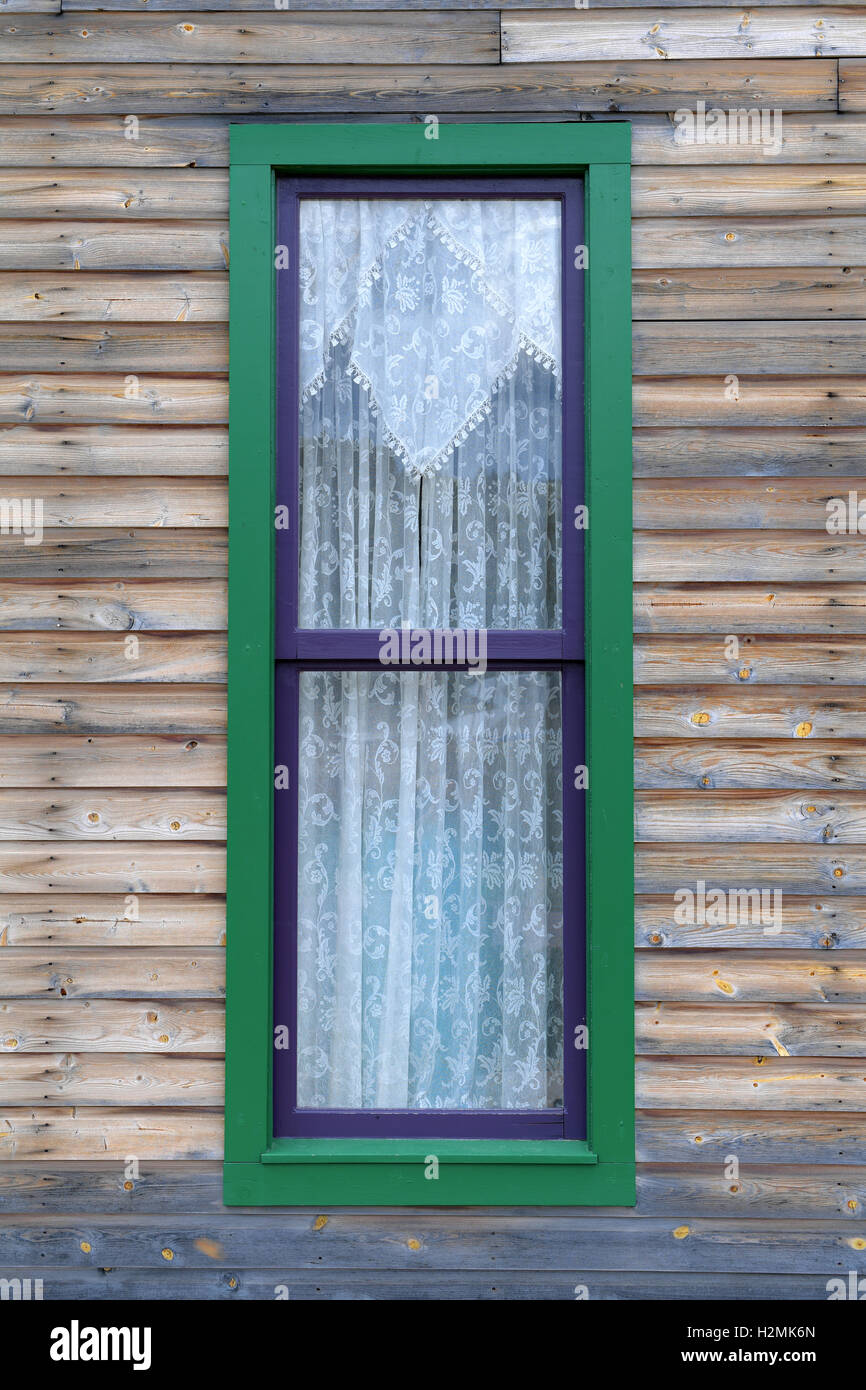 Vintage window on side of country building Stock Photo