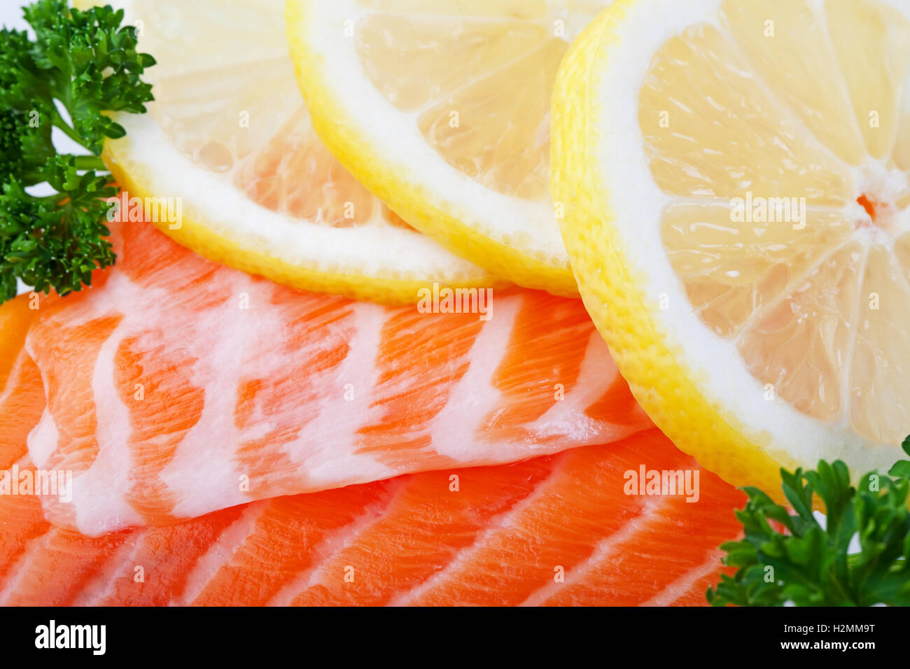Salmon With Lemon Slices Stock Photo - Alamy