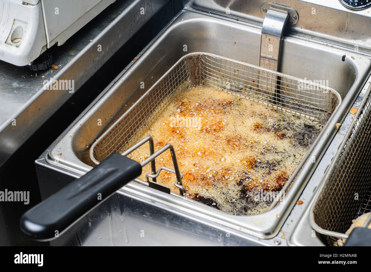 frying junk food in old oil is wrong Stock Photo Alamy