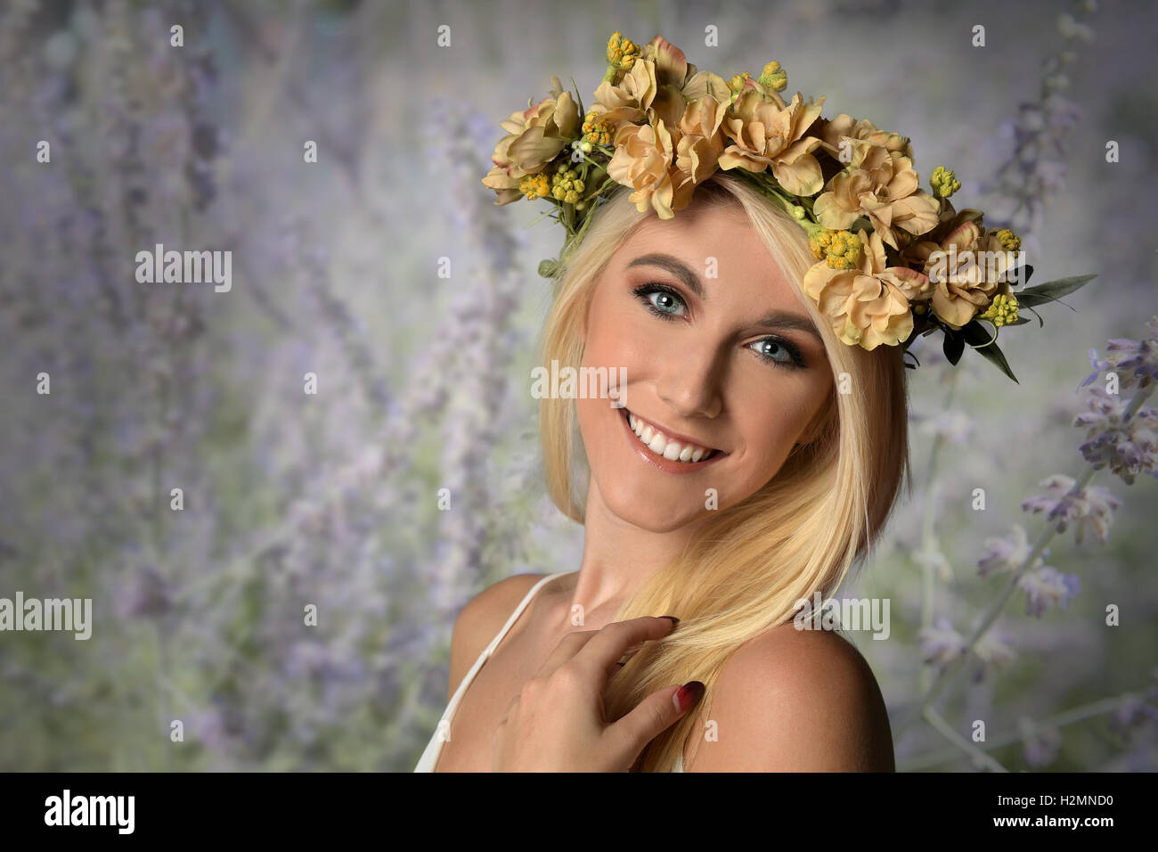 Young woman wearing flower crown smiling outdoors Stock Photo Alamy