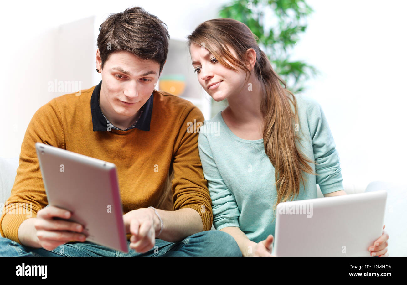 Beautiful young man showing something in his girlfriend on a tou Stock Photo